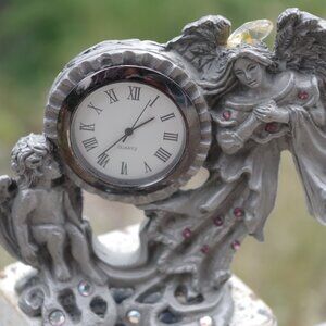Rare Pewter Mantle Cherub Angle Clock